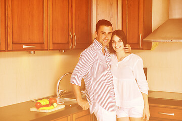 Image showing happy young couple have fun in modern kitchen