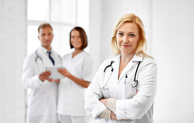 Image showing smiling doctor in white coat at hospital