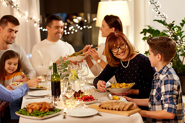 Image showing happy family having dinner party at home