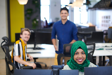 Image showing Multiethnic startup business team with Arabian woman