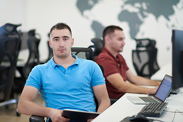 Image showing two male software developers working on computer