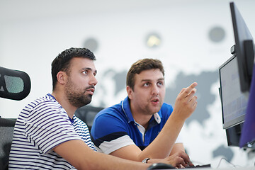 Image showing two male software developers working on computer