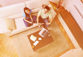 Image showing young couple working on laptop at home