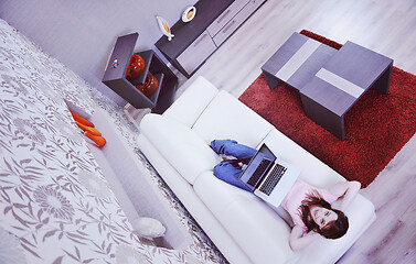 Image showing woman relaxing and working at home