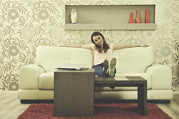 Image showing woman relaxing and working at home 