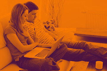 Image showing young couple working on laptop at home