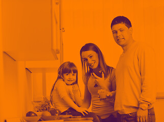 Image showing happy young family in kitchen