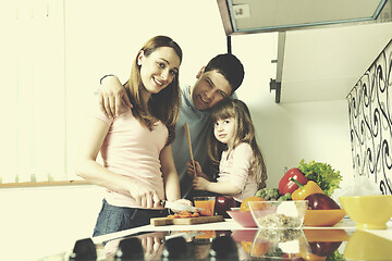 Image showing happy young family in kitchen