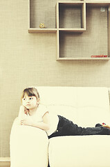 Image showing cute girl on sofa at hoe