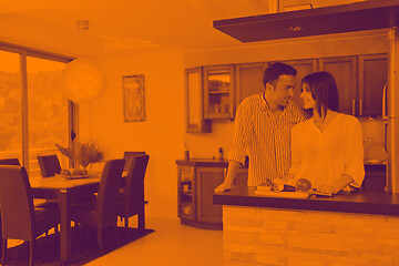 Image showing happy young couple have fun in modern kitchen