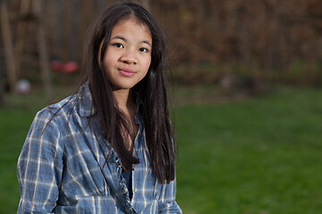 Image showing Portrait of a young cute girl looking at the camera