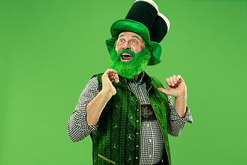 Image showing A man in a leprechaun hat at studio. He celebrates St. Patrick\'s Day.