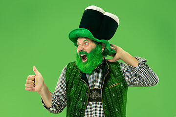 Image showing A man in a leprechaun hat at studio. He celebrates St. Patrick\'s Day.