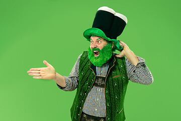 Image showing A man in a leprechaun hat at studio. He celebrates St. Patrick\'s Day.