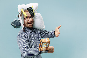 Image showing Tired man sleeping at home having too much work. Bored businessman with pillow