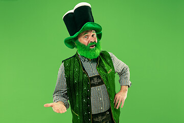 Image showing A man in a leprechaun hat at studio. He celebrates St. Patrick\'s Day.