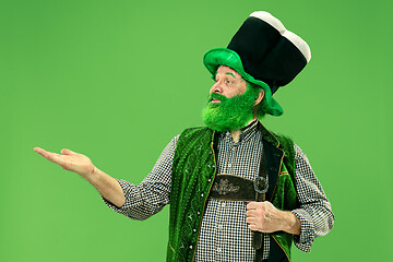 Image showing A man in a leprechaun hat at studio. He celebrates St. Patrick\'s Day.