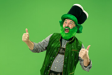 Image showing A man in a leprechaun hat at studio. He celebrates St. Patrick\'s Day.