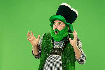 Image showing A man in a leprechaun hat at studio. He celebrates St. Patrick\'s Day.