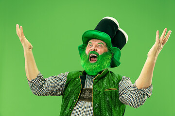 Image showing A man in a leprechaun hat at studio. He celebrates St. Patrick\'s Day.