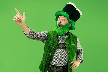 Image showing A man in a leprechaun hat at studio. He celebrates St. Patrick\'s Day.