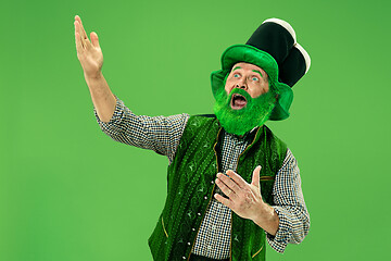 Image showing A man in a leprechaun hat at studio. He celebrates St. Patrick\'s Day.