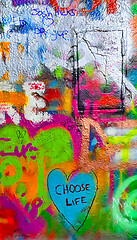 Image showing Detail of bright colorful John Lennon's wall with graffiti in Pr