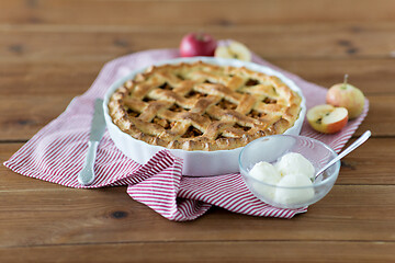 Image showing apple pie with ice cream on wooden table