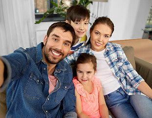 Image showing happy family taking selfie at home