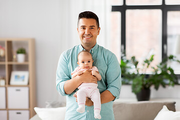 Image showing middle aged father with baby daughter at home