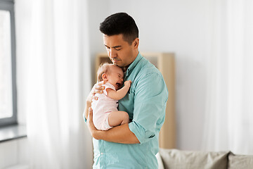 Image showing middle aged father with baby daughter at home