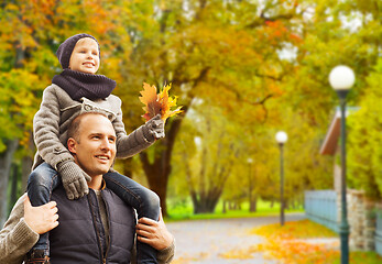 Image showing happy family having fun in autumn park