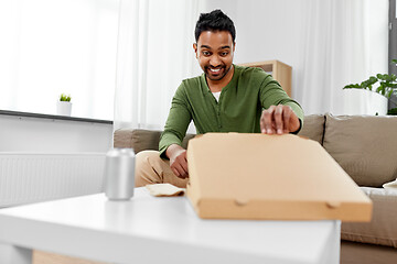 Image showing indian man looking inside of takeaway pizza box