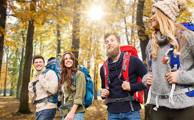 Image showing friends with backpacks hiking in autumn