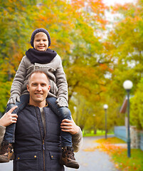 Image showing happy family having fun in autumn park