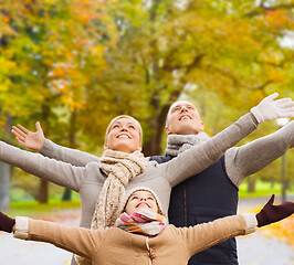 Image showing happy family having fun in autumn park