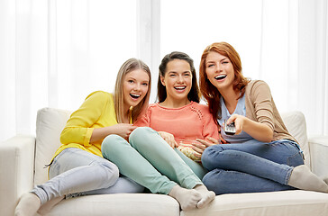 Image showing teenage girls or friends watching tv at home