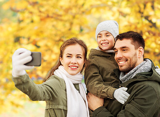 Image showing family taking selfie by smartphone in autumn park