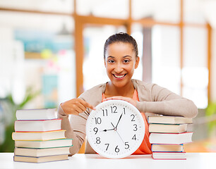 Image showing african american student with clock and books