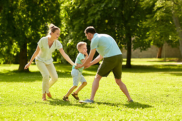 Image showing happy family playing at summer park