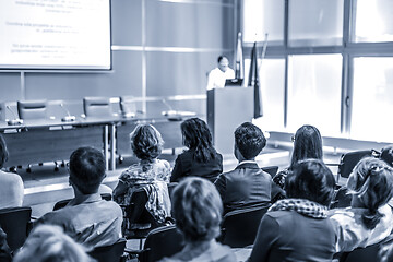 Image showing Woman giving presentation in lecture hall at university.