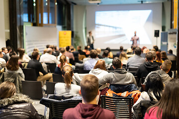 Image showing Business speaker giving a talk at business conference event.