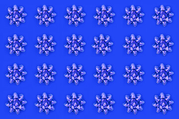 Image showing Lilac Bow Pattern on Blue Background  