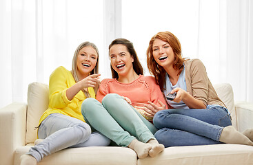 Image showing teenage girls or friends watching tv at home