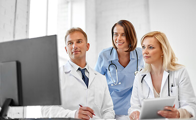 Image showing group of doctors with computer at hospital