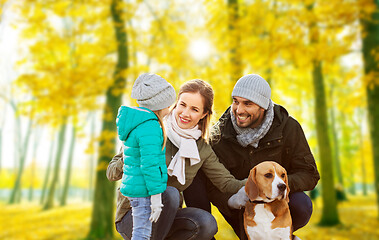 Image showing happy family with beagle dog in autumn park