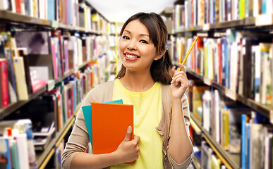 Image showing asian student woman with books and pencil