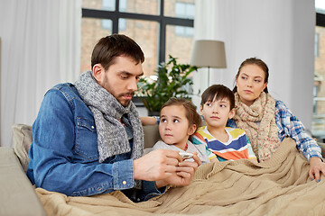 Image showing family with ill children having fever at home