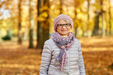 Image showing portrait of happy senior woman at autumn park