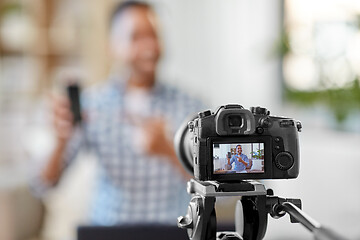 Image showing camera recording video blog of smartphone